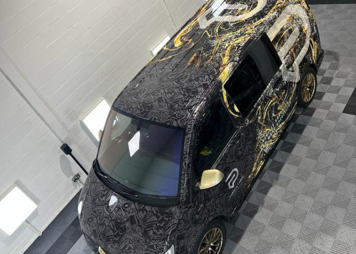 Costum made Prestige Graphics personal van full wrap gold,black,grey and white which works well with each other - top view